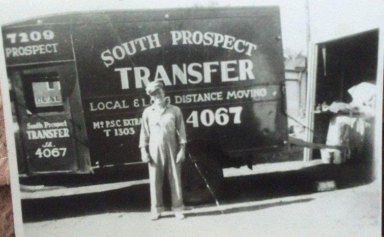 Bill Cartwright Sr in front of South Prospect Transfer Truck